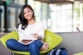 An esthetician student studying to achieve her esthetician licensing.